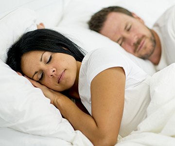 Man and woman sleeping soundly