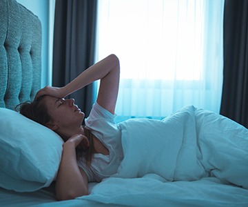 a patient in bed trying to sleep