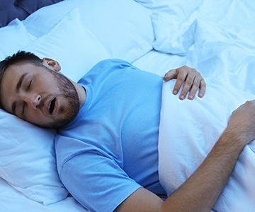 a person snoring while asleep 