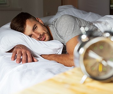 a patient struggling to sleep due to sleep apnea