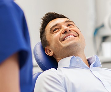 Smiling man in dental chair