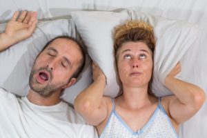 man snoring loudly woman upset