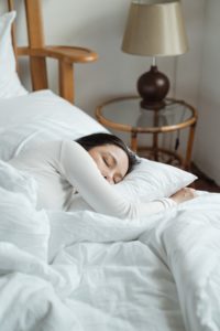 Woman napping in bed