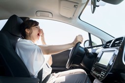 person driving a car while drowsy